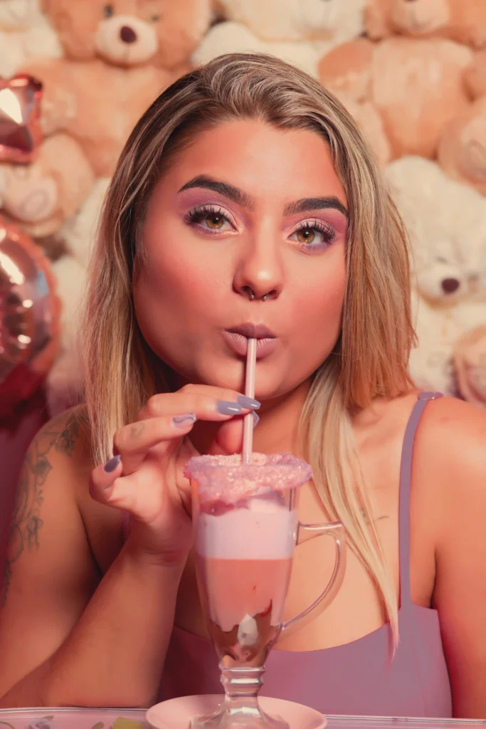 Pink outfit girl drinks the juice