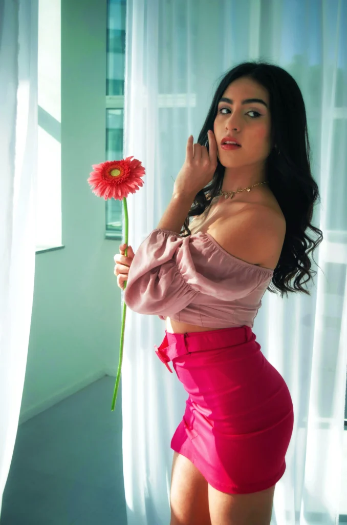 girl with rose in pink outfit